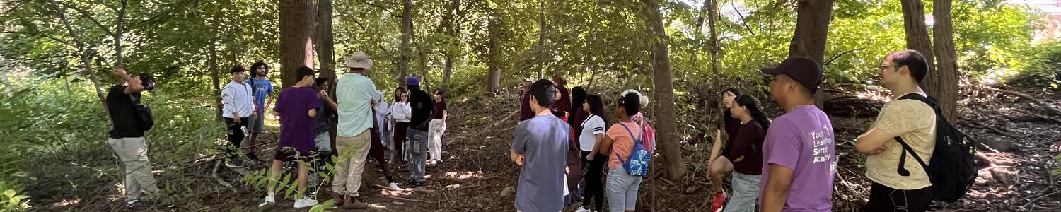 IRIS youth with Chris Ozyck in East Rock Park's woods 