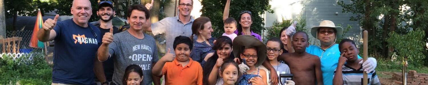 Adults and kids with thumbs up