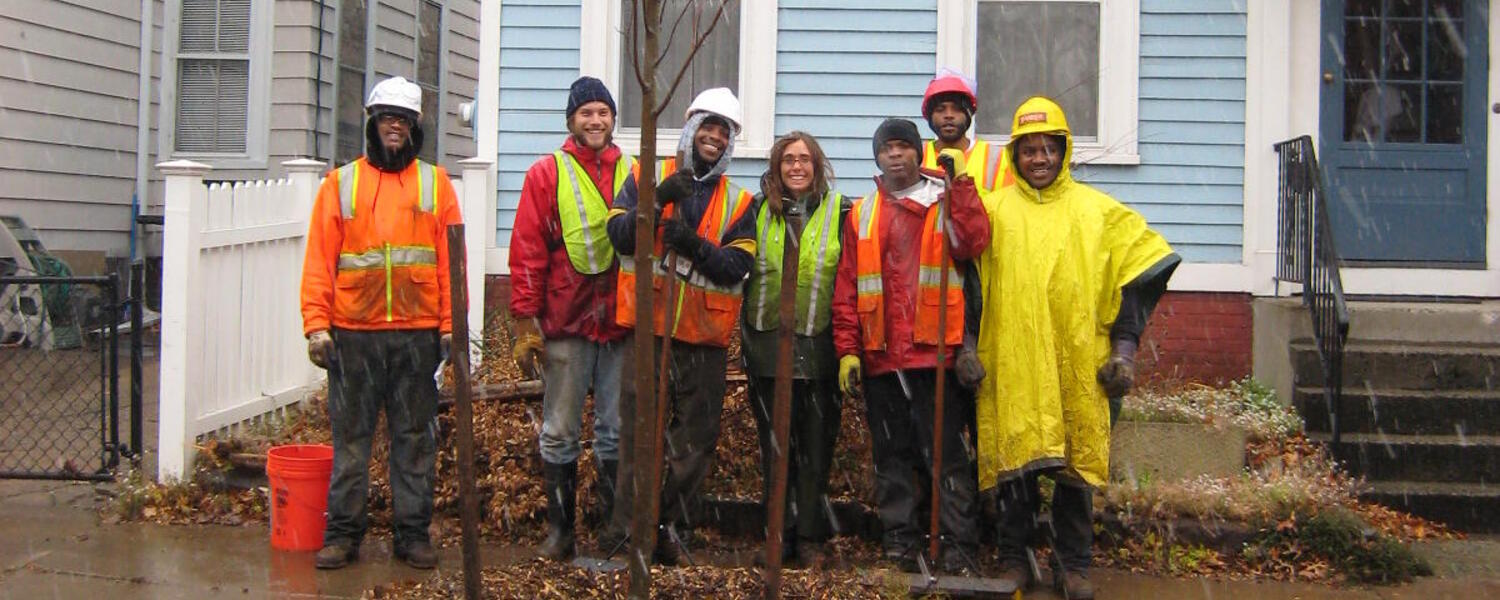 Margaret Carmalt and GreenSkills tree crew planting in the rain