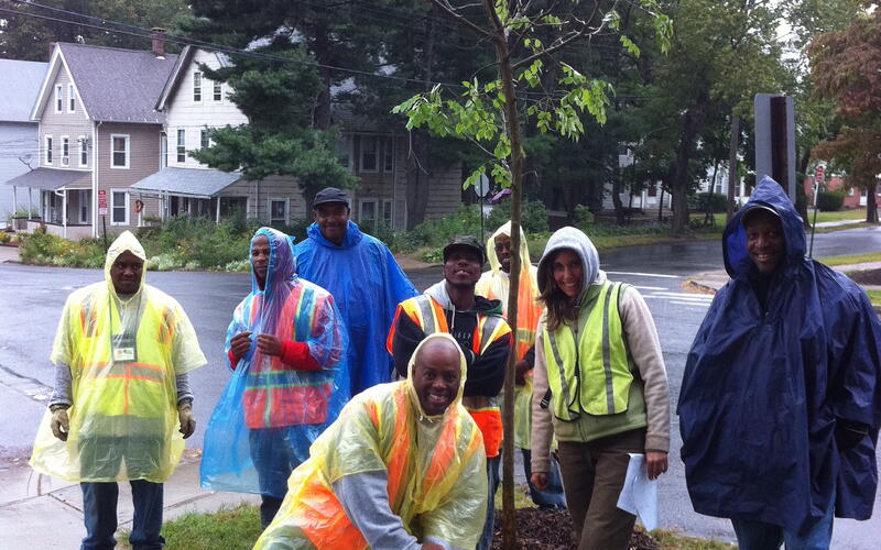 Margaret Carmalt, Don Williams and GreenSkills planting crew in rain gear in 2011