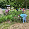 Jim and Judy weeding by the stone sign garden!