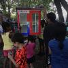 Kids painting the lending library box