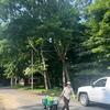 Margaret bringing water to water young shrubs and dogwood!