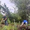 Pat and Tim weeding and planting at pondside garden!
