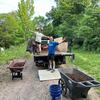 Yvonne and Sam shoveling off mulch!