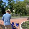 Volunteers spreading mulch at the Sea Street Circle