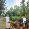 Sandy and Clara loading mulch to spread on the path!