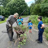 Frank and the kids moving the brush to our designated brush pile!