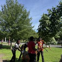 Kymani, Luis, Terell, and Freddie moving the red maple!