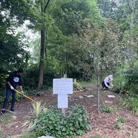 Nia working on the path, while Susan weeded!