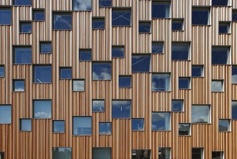 wooden building with lots of windows
